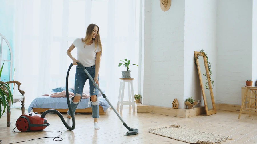A cleaner vacuuming a bright, modern living room